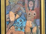 painting of two nudes in a gold frame hanging on a blue wall