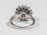 an image of a silver ring with a sunburst on it