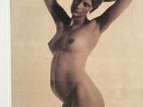 an old photo of a nude woman posing in a white frame