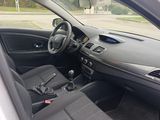 the interior of a car with the door open and the driver ' s seat down