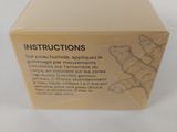 an open box of instructions on a white surface