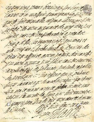 une lettre écrite en cursive sur une feuille de papier