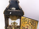 a clock that is sitting on a table next to a key