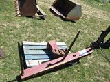 a fork on a pallet in the grass