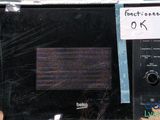 a microwave with a price tag on it sitting in a cardboard box