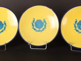 three yellow and blue plates with the emblem of the united states