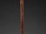 an image of a baseball bat with a wooden handle on a black background