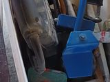 a bucket full of tools sitting on the floor