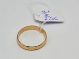 a close up of a ring on a white surface with a price tag
