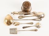 a lot of silver spoons and spoon spoons on a white surface