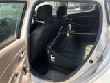 a car that has a suitcase in the back of it