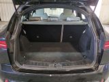 a trunk of a car with the back door open