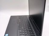 a laptop with a black keyboard on a white surface