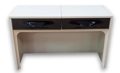 a white and black desk with two black bowls on it