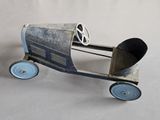 a toy car with wheels and a wheel on it