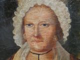portrait d'une femme portant un bonnet blanc et une robe marron