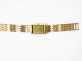 an image of a close up of a wrist watch on a white surface