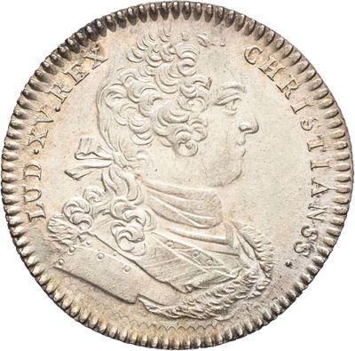 une pièce en argent portant le portrait d'un homme