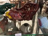 a glass display case filled with vases and other decorative items