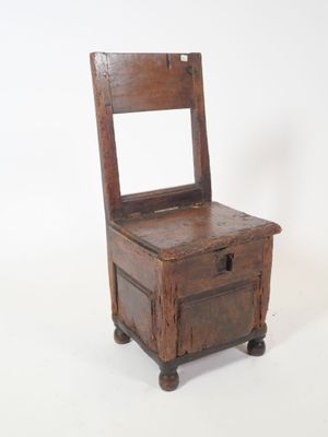 an old wooden chair sitting on top of a white surface