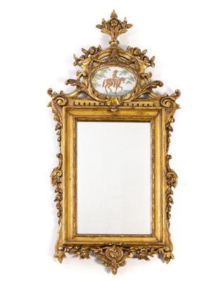 an image of a gold framed mirror with a picture of a horse on it