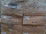 a large stack of boxes sitting on a pallet in a warehouse