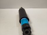 a close up of a black cylinder on a white surface