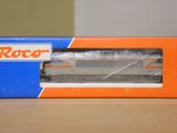 an orange and blue box sitting on top of a wooden table