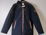 a close up of a jacket on a hanger on a wall