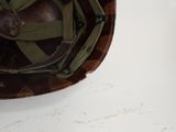 a close up of a helmet on a white surface