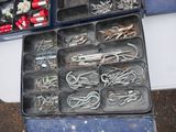 many different types of fishing hooks in a box