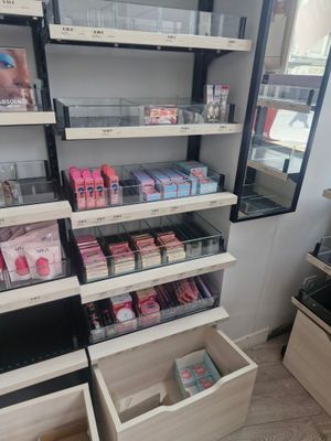 a lot of cosmetics products on the shelves in the store