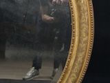 a man taking a picture of himself in a mirror