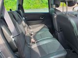 the interior of a car with two rows of seats in it
