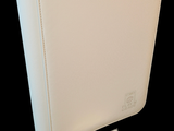 an image of a white binder with a notepad on it