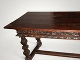 an image of a wooden table with carvings on it