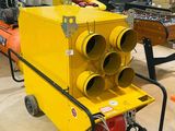 a yellow machine that is sitting in a warehouse