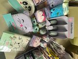 a lot of toothbrushes and toothpaste on the table