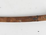 a wooden stick that has a wooden handle on it