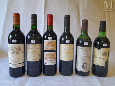 several bottles of wine are lined up on a table