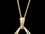 un pendentif en or jaune orné de trois diamants, monté sur une chaîne