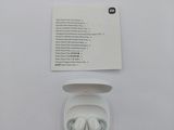a white box with earphones in it sitting on a table