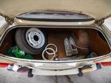 a trunk of a car with a bunch of items in it