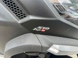 a close up of a motorcycle with a number plate on the front of it