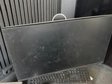 a computer sitting on top of a box next to a radiator