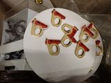 five red and gold rings on top of a white cake