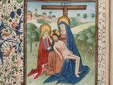 an open book with a picture of jesus on the cross