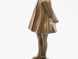 bronze statue of a girl in a hat and dress on a pedestal