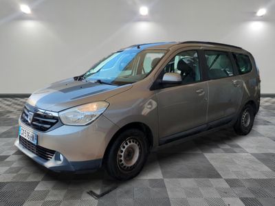 the silver van is parked on a checkered floor in a room