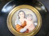 a picture of a picture of a woman and a child on a plate